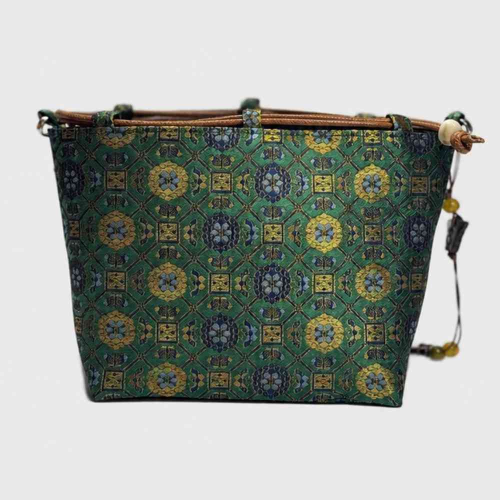 Imperial Treasures Song brocade bag - side view of silk crossbody handbag with beaded charm