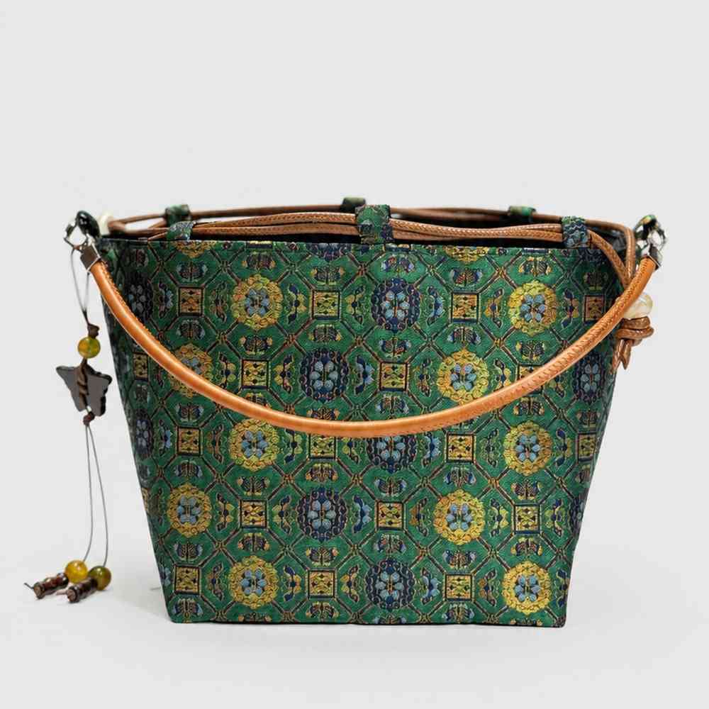 Imperial Treasures Songjin brocade silk bucket bag - hero shot of handwoven Chinese pattern handbag
