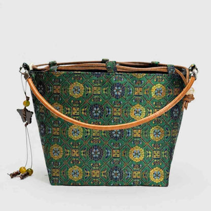 Imperial Treasures Songjin brocade silk bucket bag - hero shot of handwoven Chinese pattern handbag